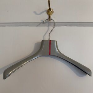 Prada Grey Hanger with Red Logo Stripe designer.